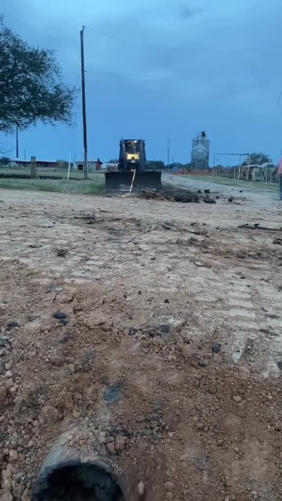Unclogging pipe with a tractor